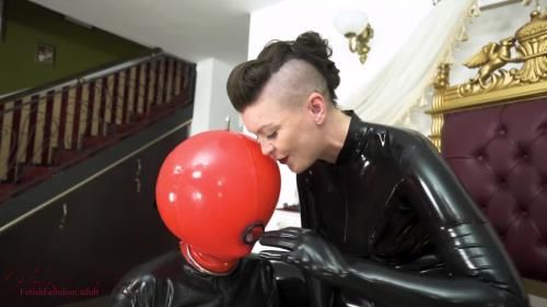 Lady Valeska tests Her inflatable toys gag reflex with Her fingers before fucking him in the mouth with Her big strap-on